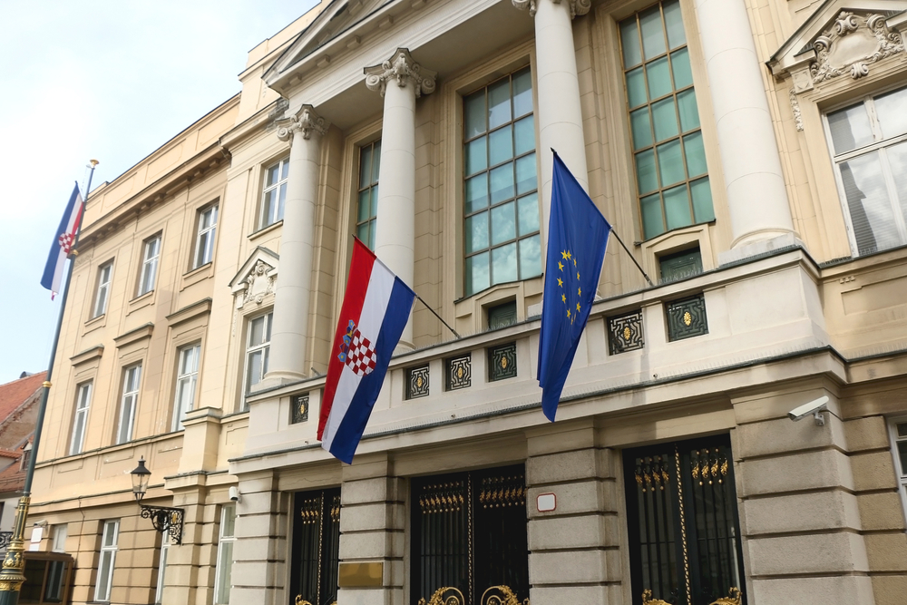 Croatian Parliament building, with flags of European Union and Croatia